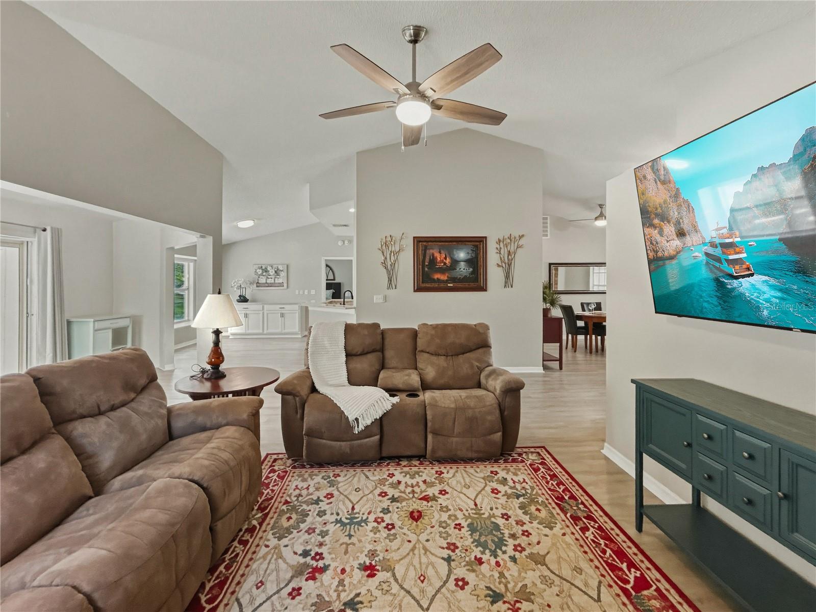 Living room opens to dining room, kitchen and bonus room