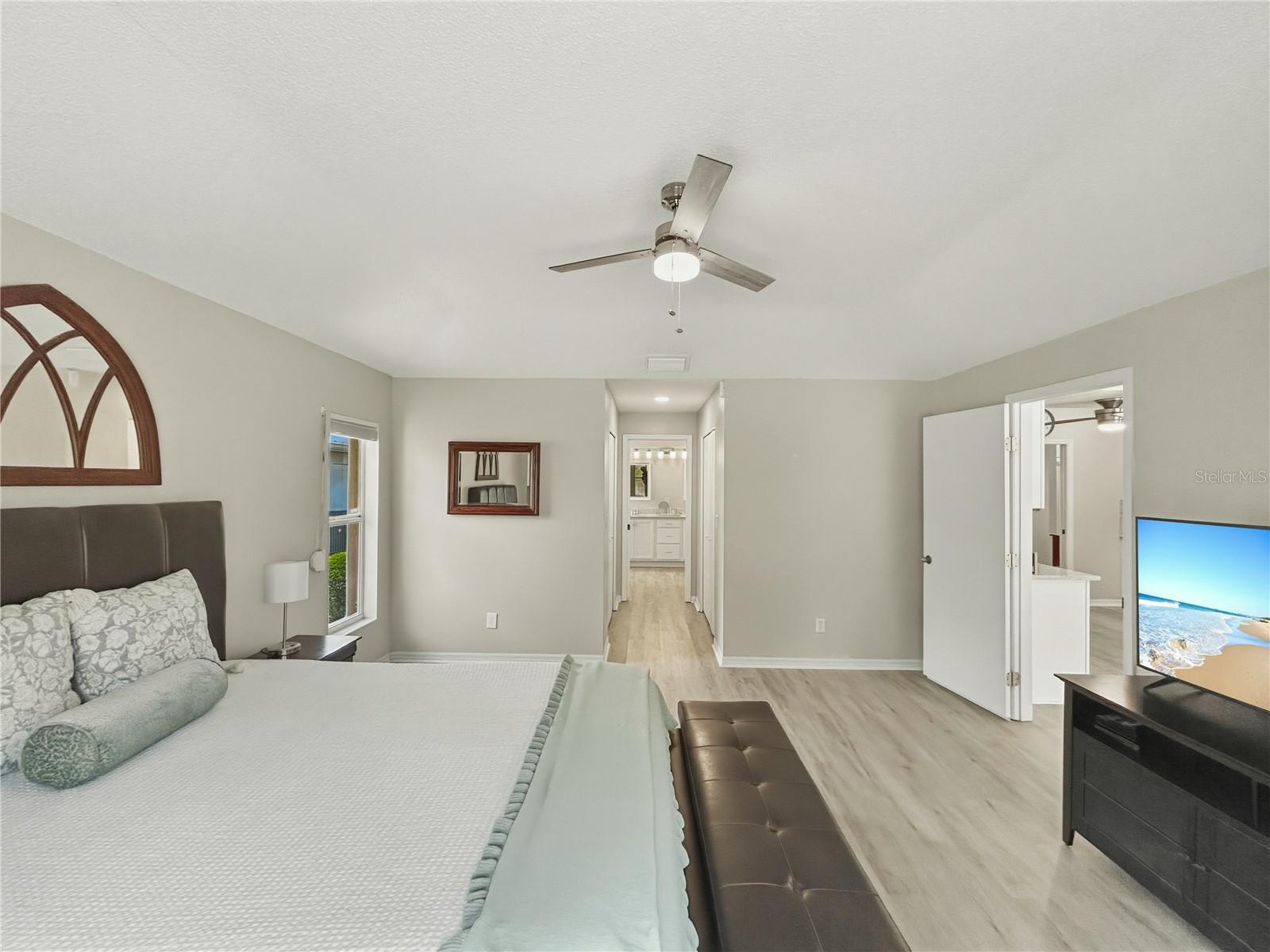 Primary bedroom leads to 2 walk-in closets, toilet and primary bathroom