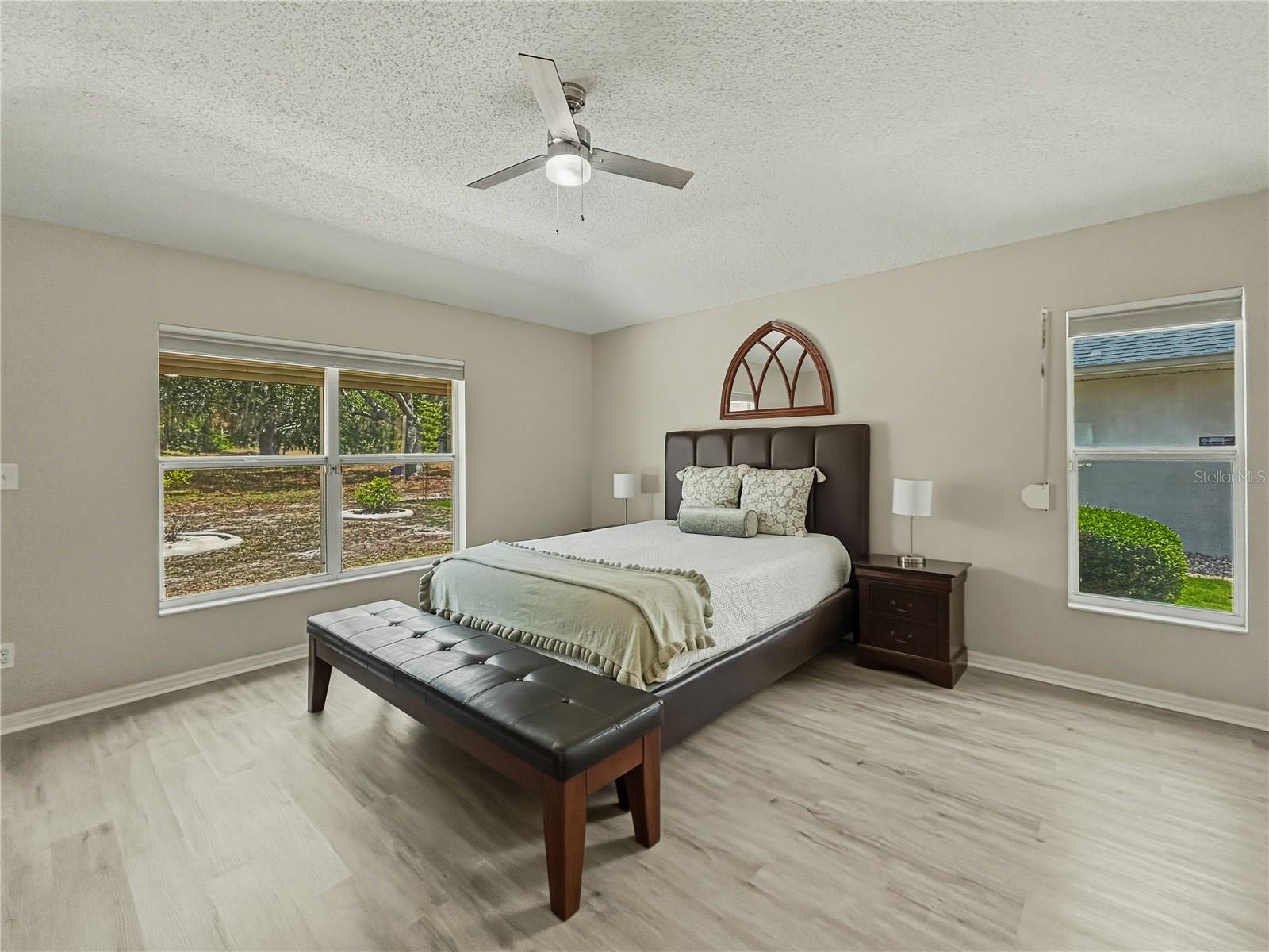 Oversized primary bedroom with 2 walk-in closets