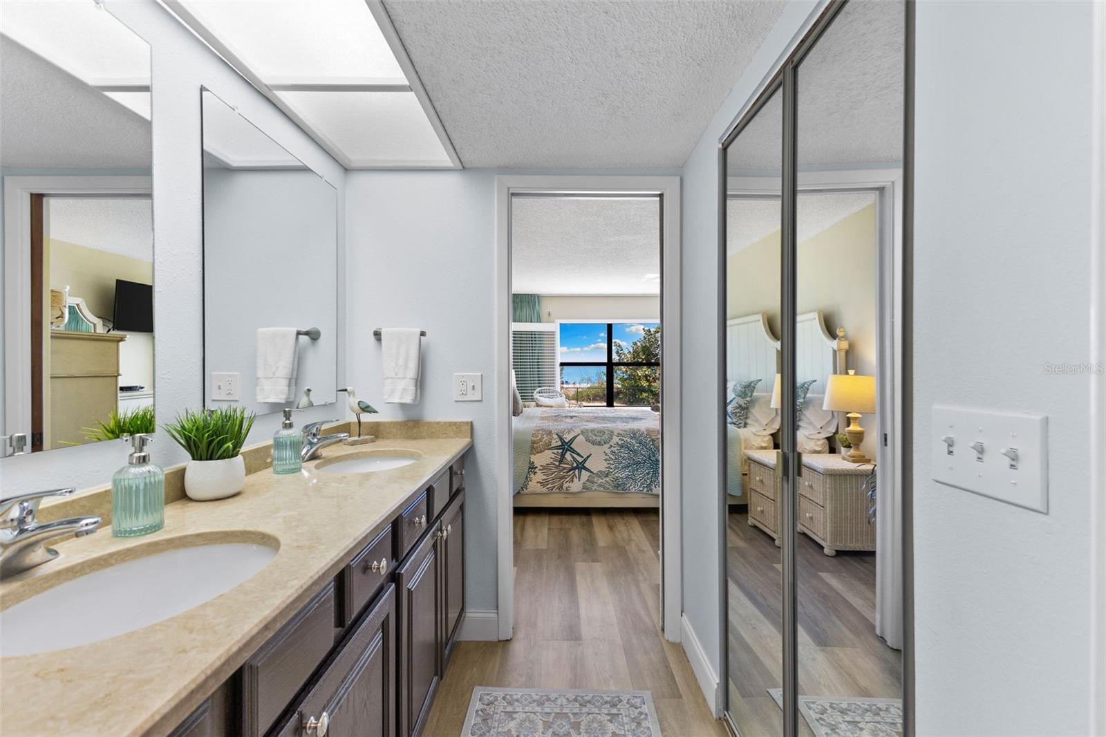 Primary Bathroom with dual vanities and quartz countertops