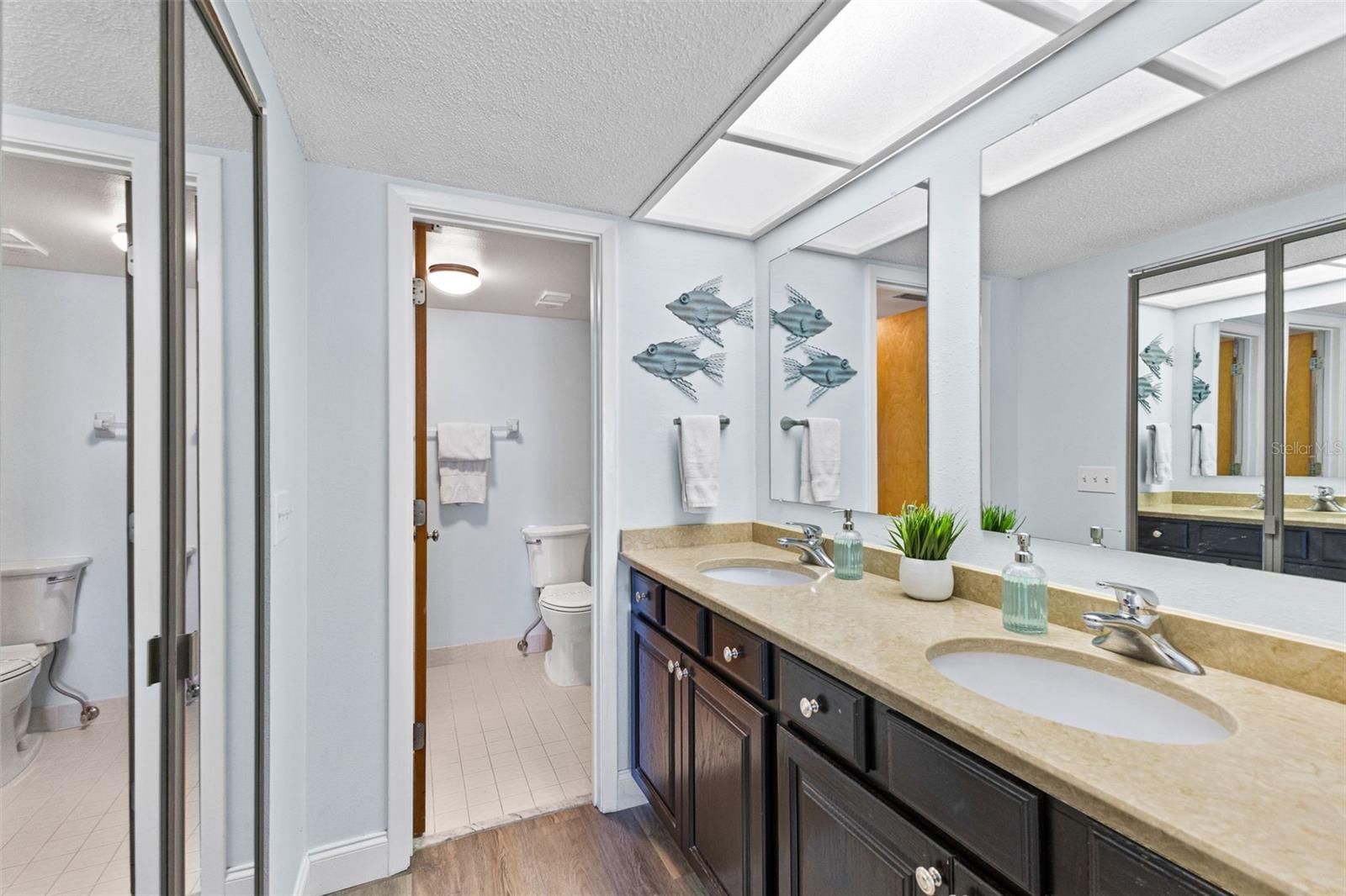 Primary en suite bathroom with private shower and water closet