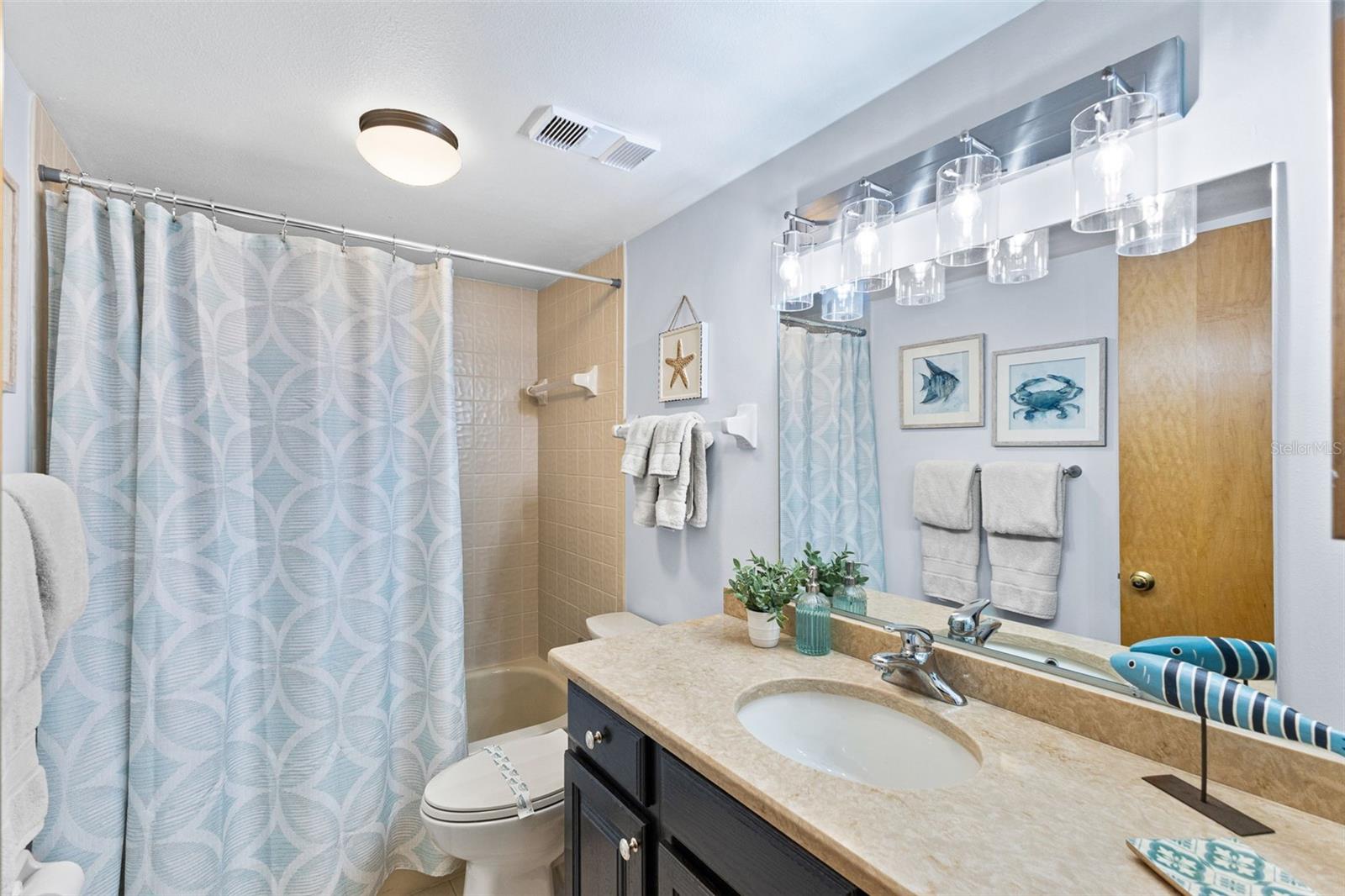 Second Bathroom with quartz countertops and tub/shower combo