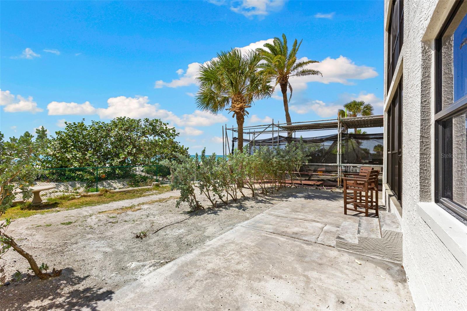 Back Patio and view of beach access (scaffolding to the right to be removed when work is completed estimated end of May)
