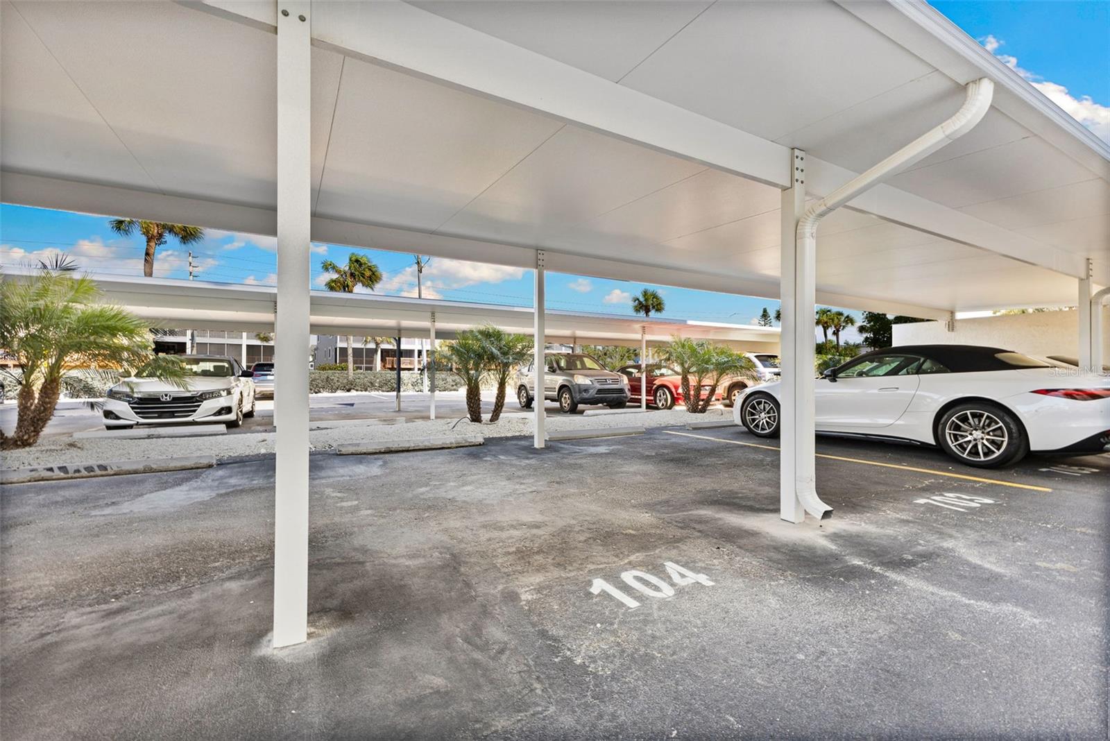 Carport! One of the few covered parking spots deeded to your unit!