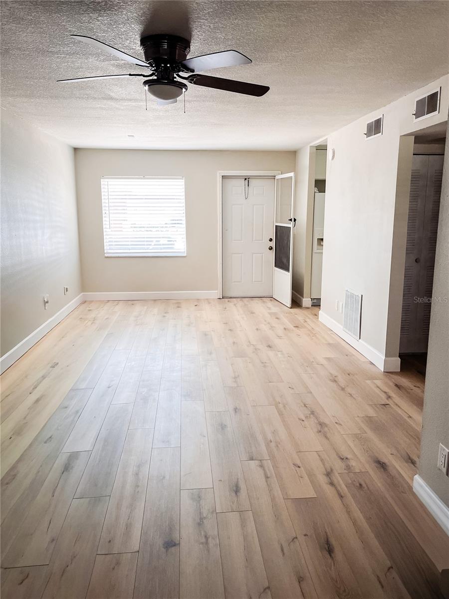 Living Room looking at front window and door.