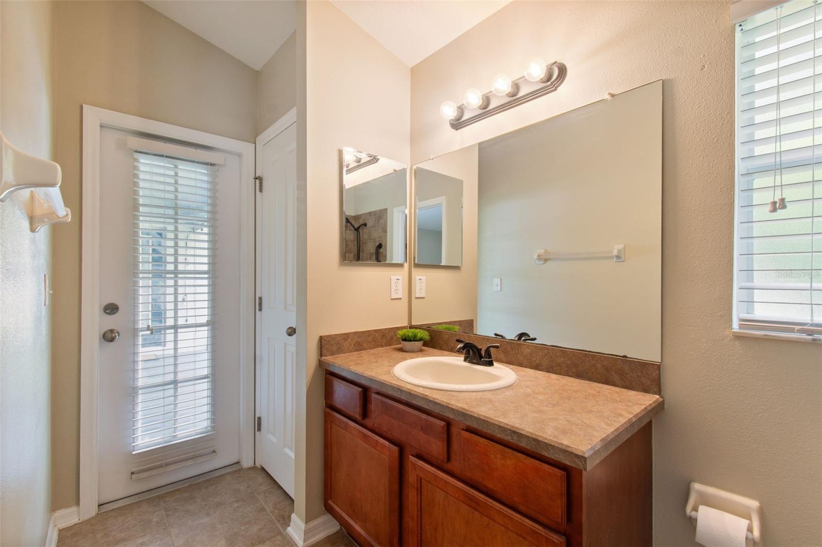Bathroom 2 with door to patio