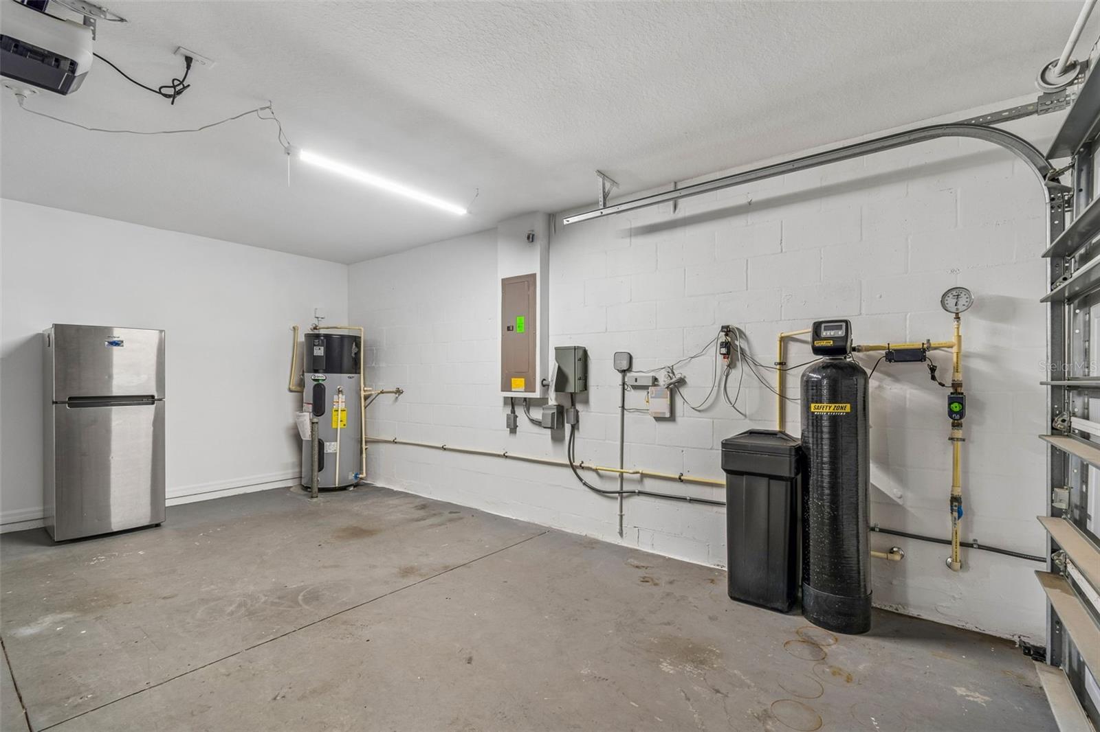 Garage-Water heater with heat recovery and whole home water softener