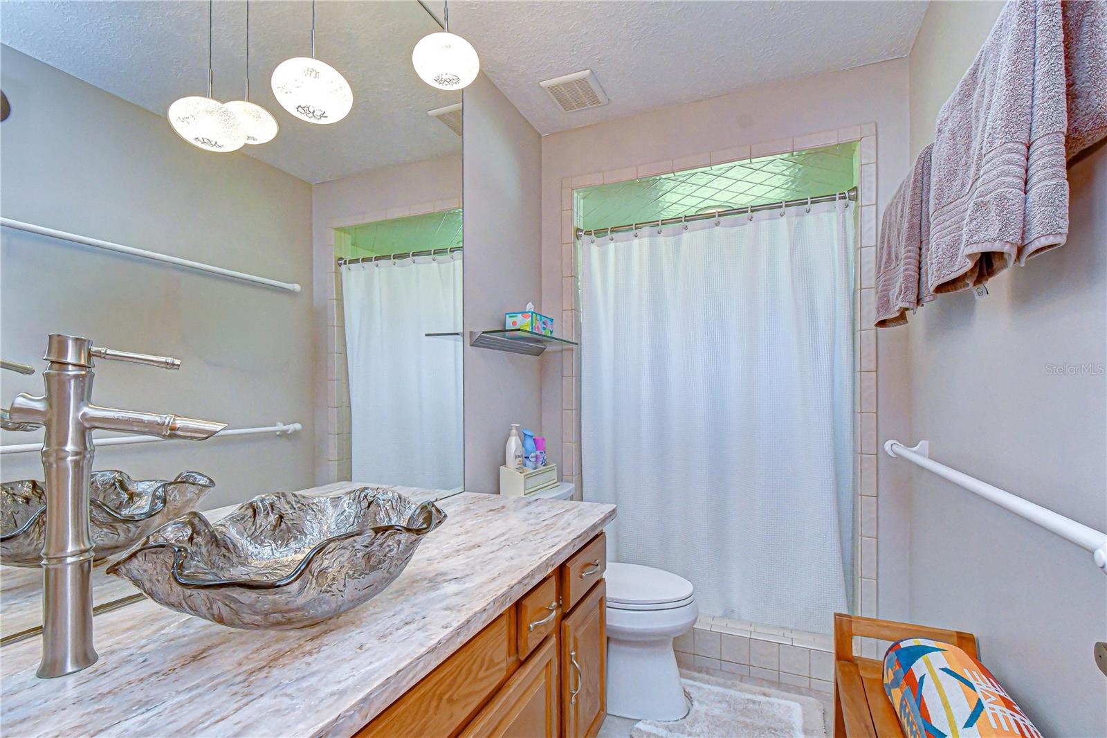 Well-maintained secondary bath with updated features