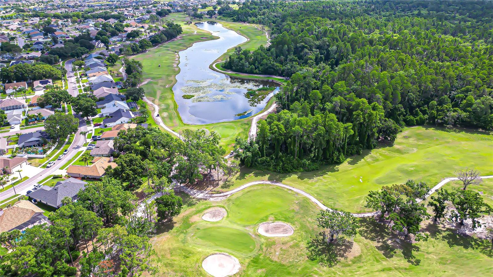 Premier .25-acre homesite with panoramic golf course and water views