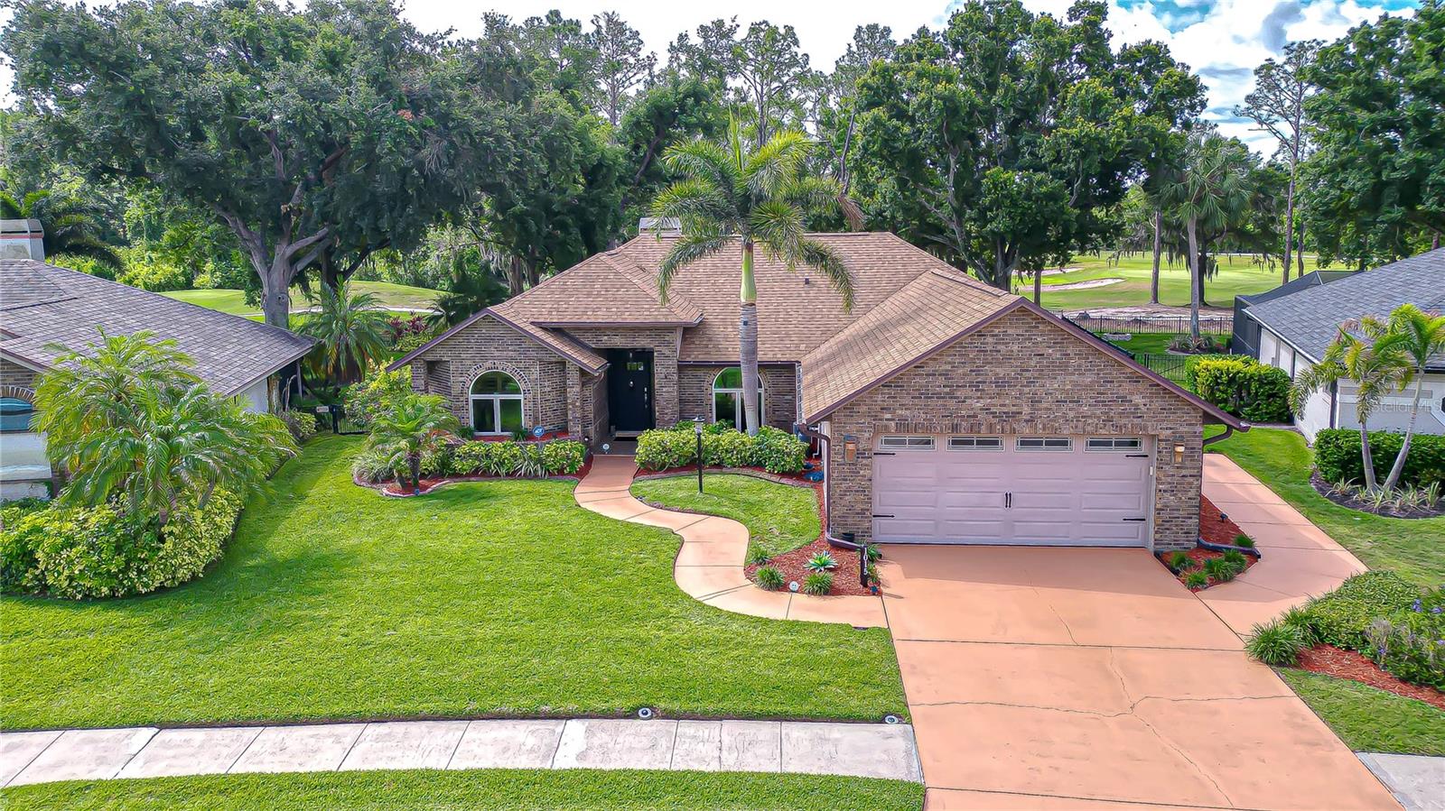 Spacious driveway leading to oversized garage