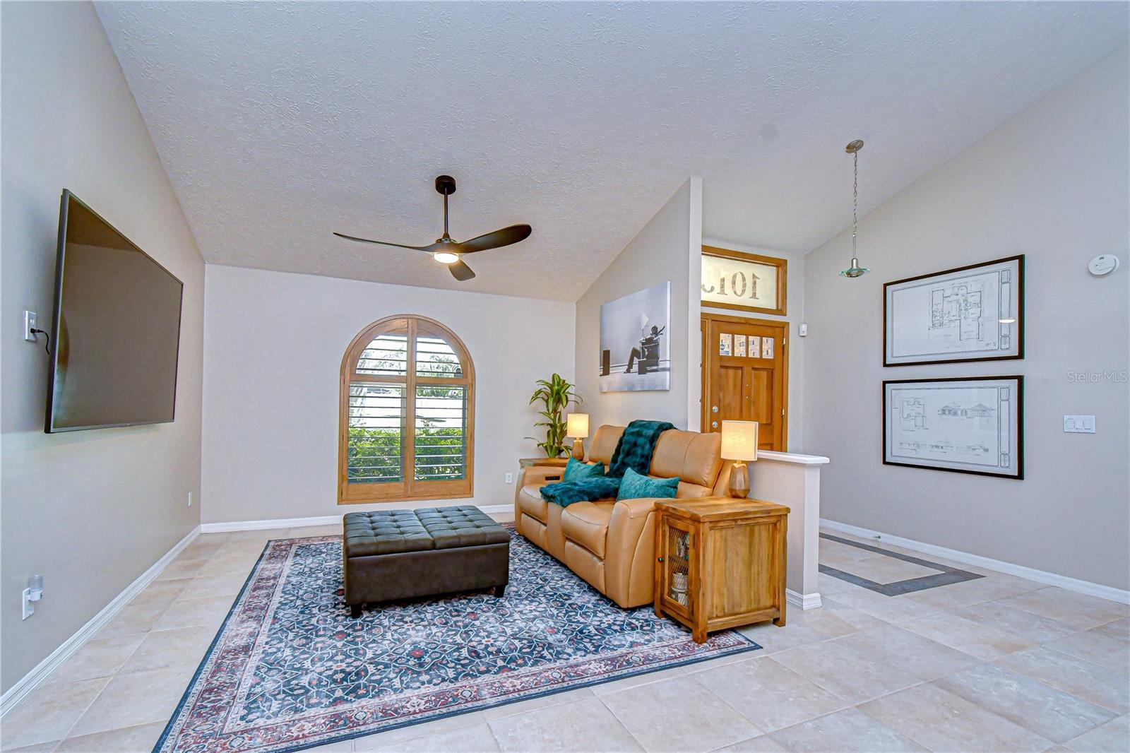 Welcoming entry with soaring vaulted ceilings and open design