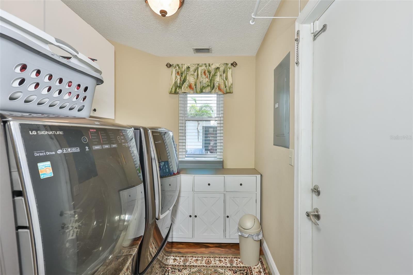 Indoor Laundry, New LG Signature Washer & Dryer, Upper & Lower Cabinetry & Folding Area