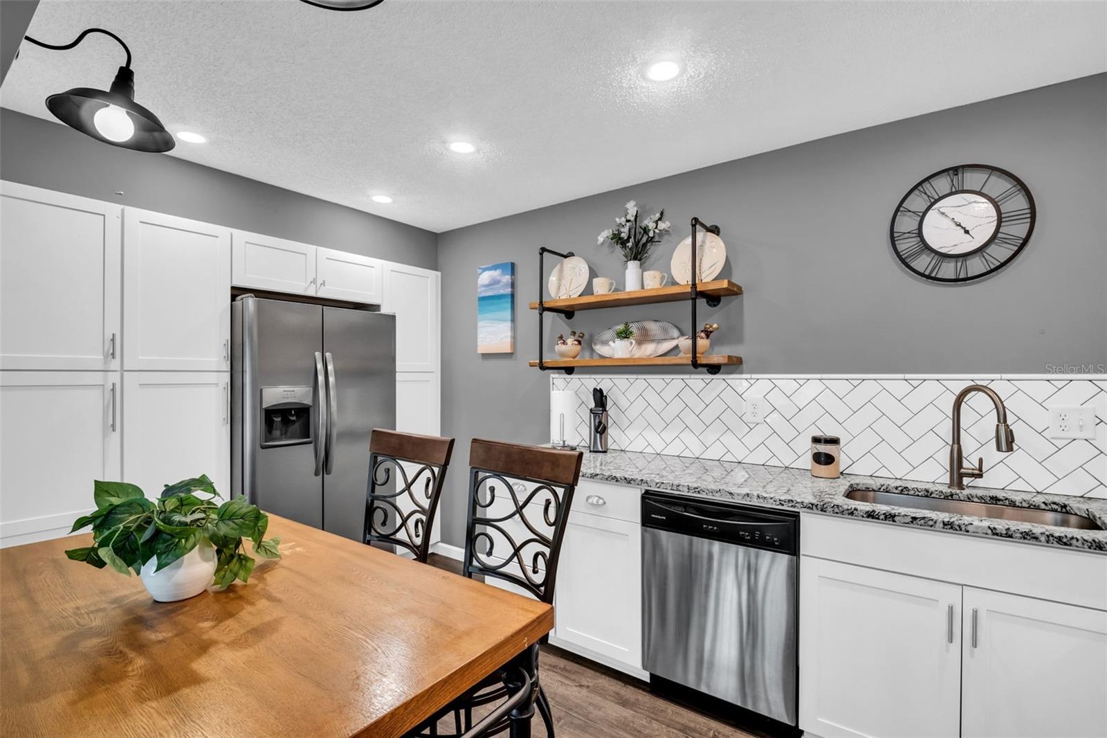 Abundant cabinetry and built-in pantry~