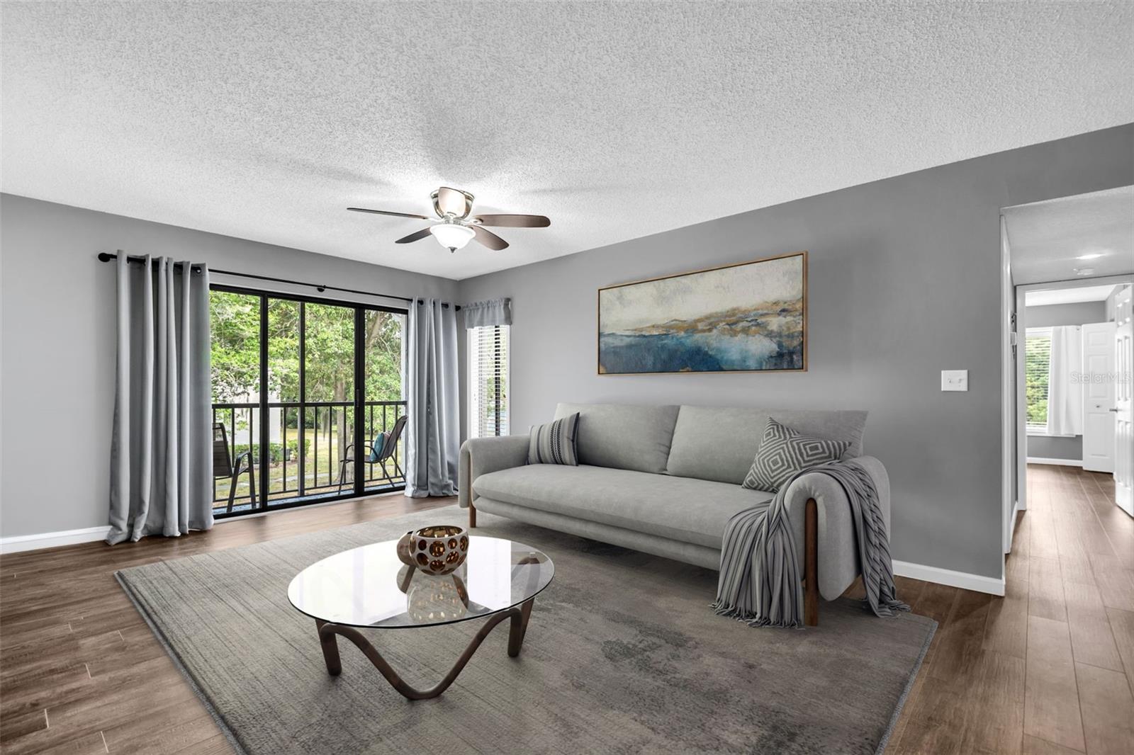 Beautiful luxury vinyl plank flooring, large glass sliders out to screened lanai offering year-round enjoyment~