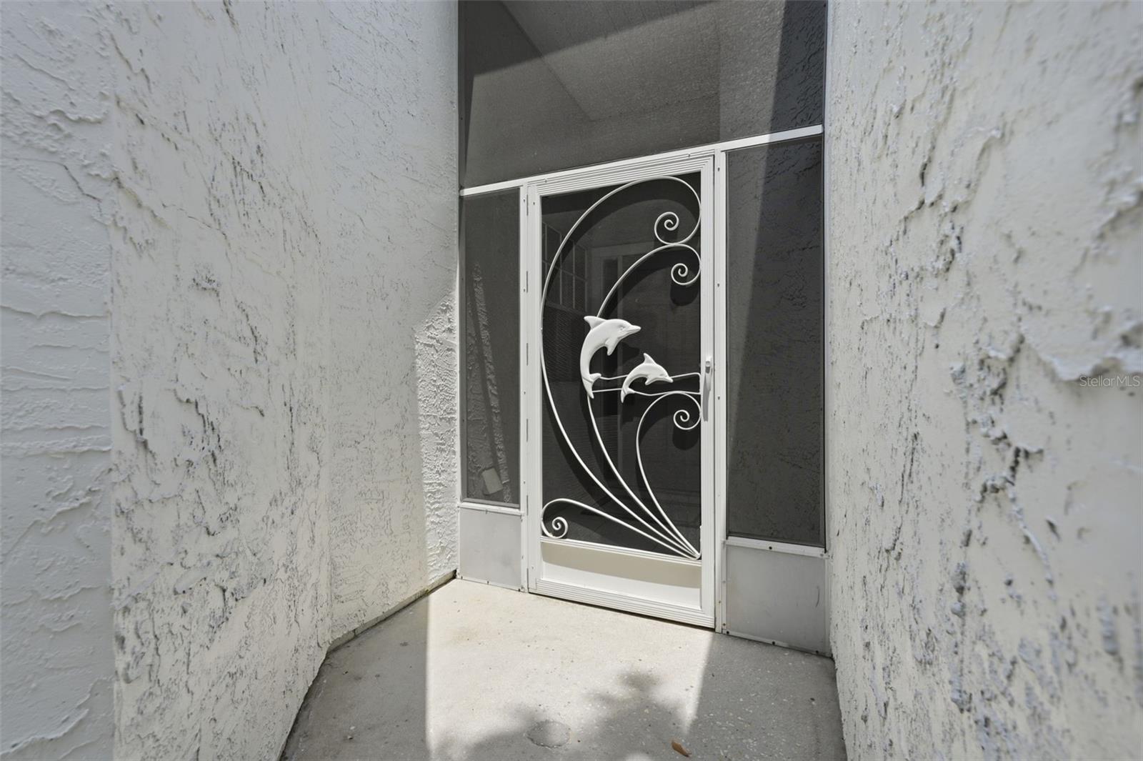 Front Door.  This photo was virtually staged to show the potential of the room.