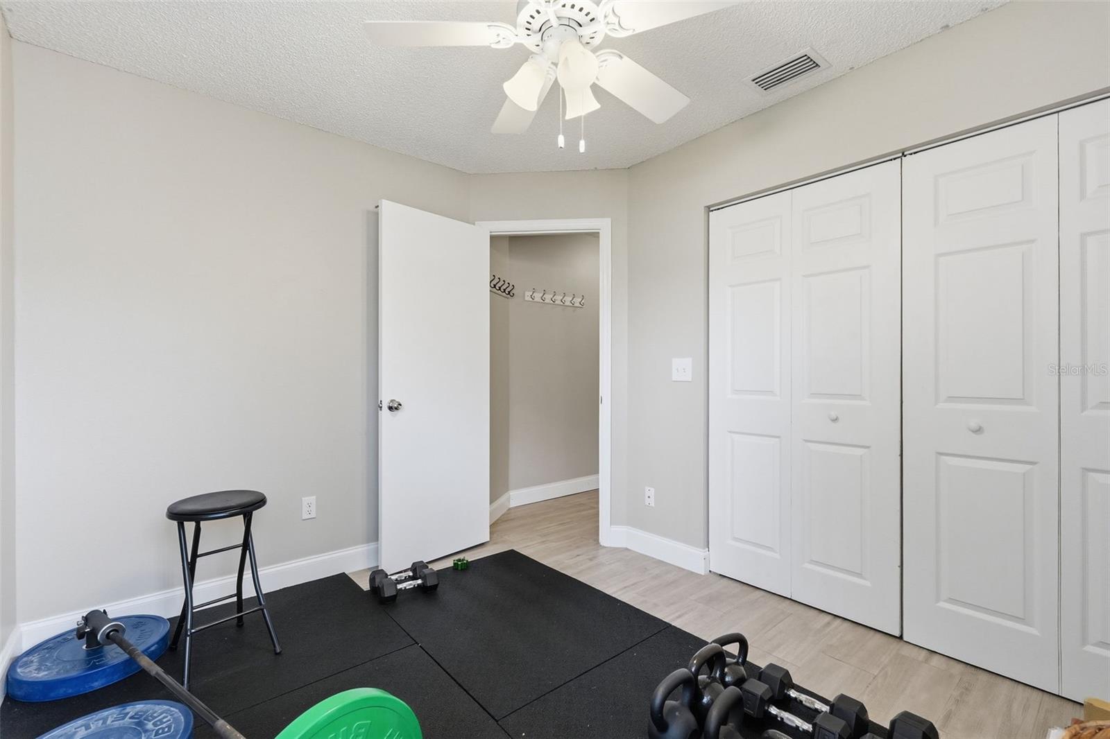 Screened in lanai. This photo was virtually staged to show the potential of the room.