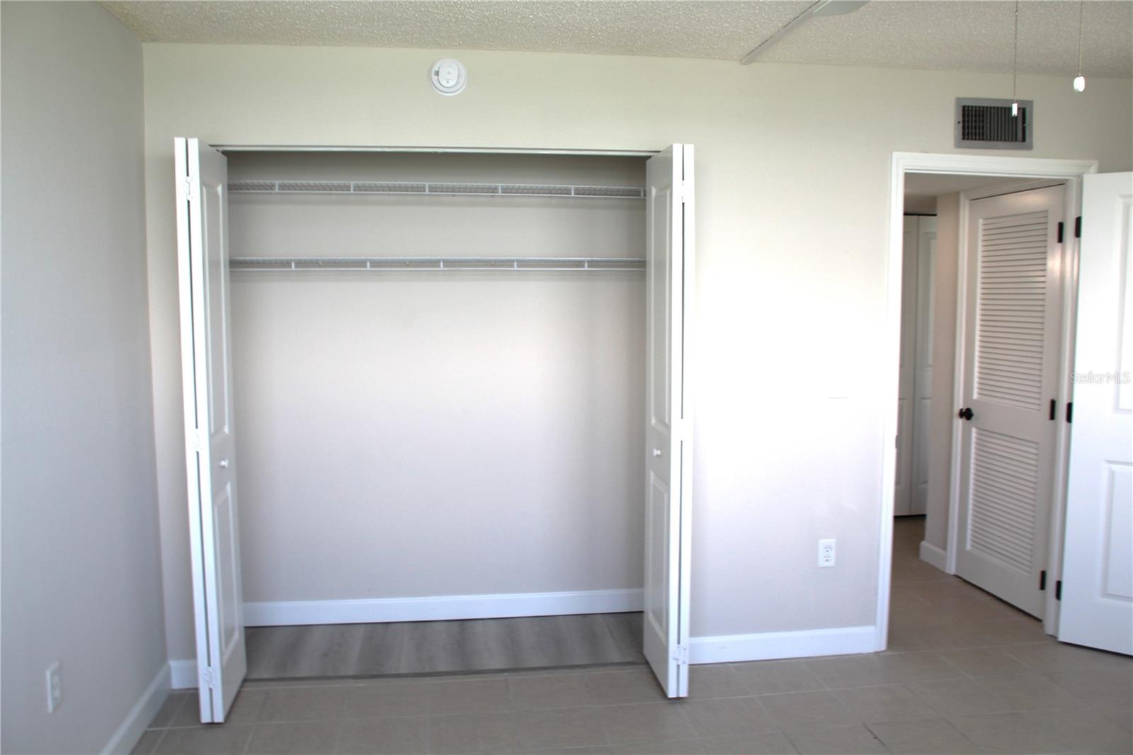 Features a spacious bedroom closet