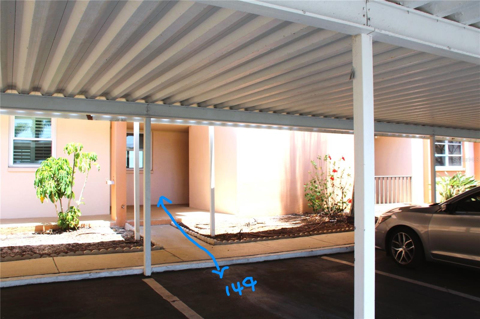 Enjoy the convenience of covered, assigned parking positioned directly in front of your condo, offering effortless access