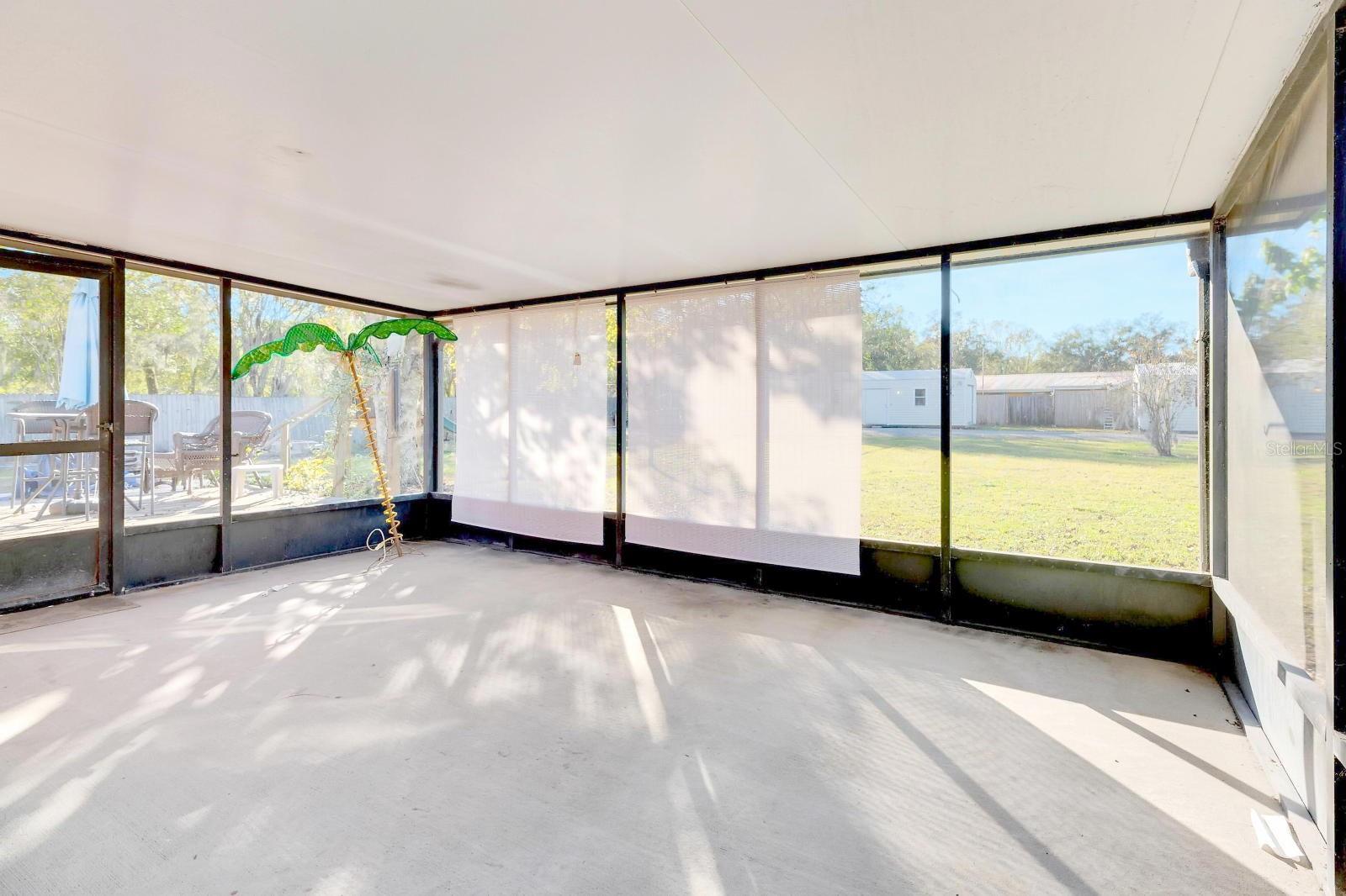 LARGE BACKYARD SCREENED PATIO