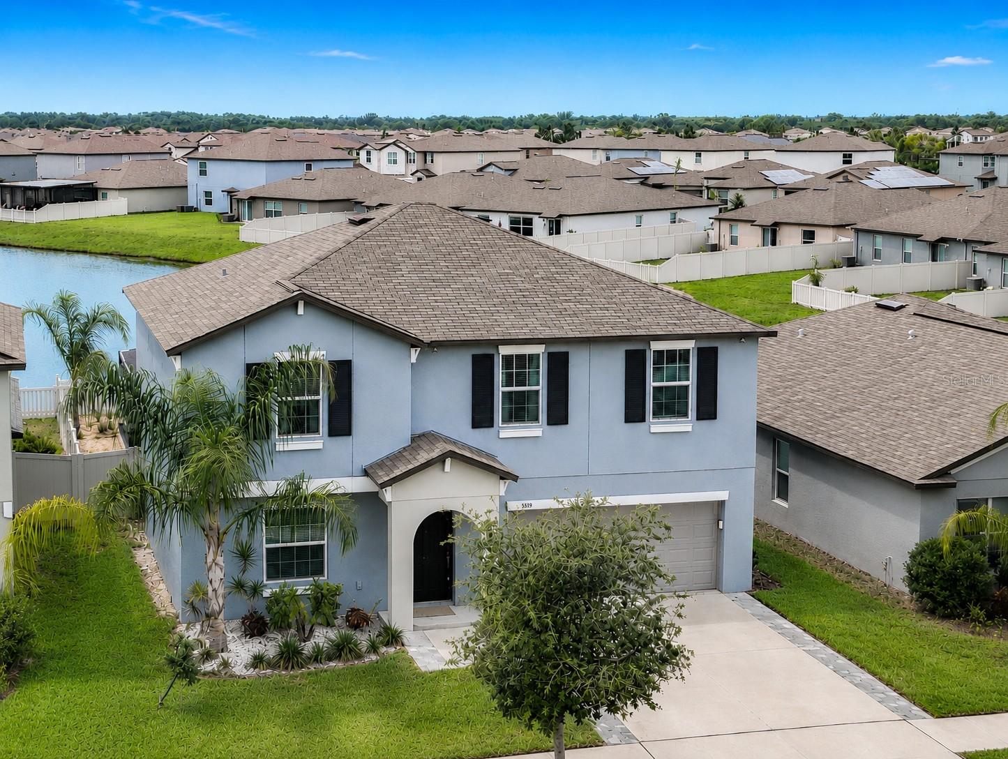 Welcome to 5519 Blue Azure Drive, a beautifully upgraded 4-bedroom, 2.5-bath home featuring a versatile flex room, spacious bonus loft, and a stunning heated saltwater pool and spa overlooking peaceful pond views—offering the perfect blend of comfort, style, and Florida living!