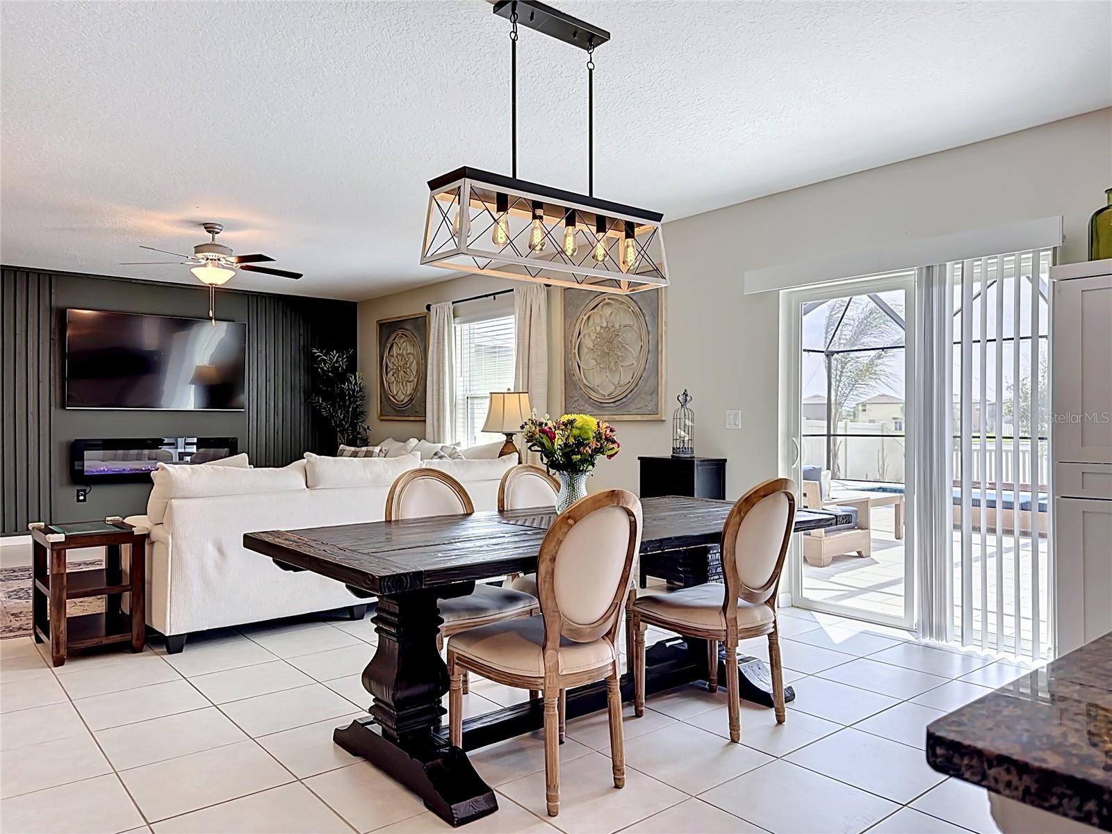 Beautiful kitchen and dining area with updated lighting and modern finishes