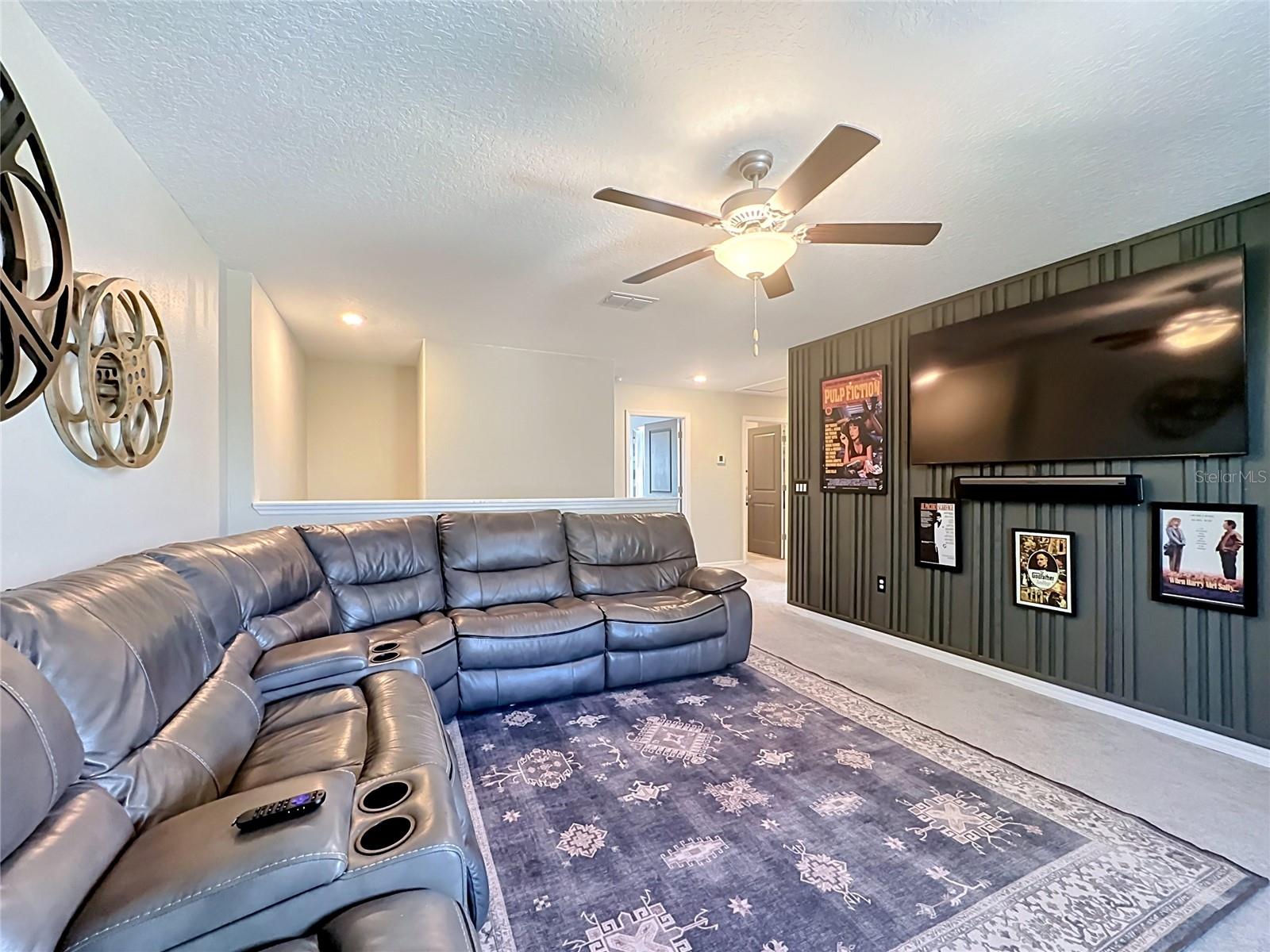 Second-level loft with custom accent wall