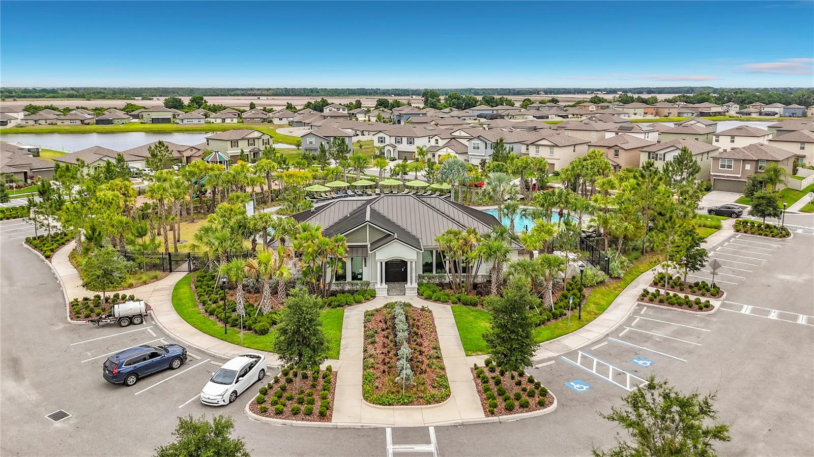 Berry Bay's resort-style amenities include a zero-entry pool, clubhouse, picnic areas, dog park, playground, basketball courts, and pickleball courts.