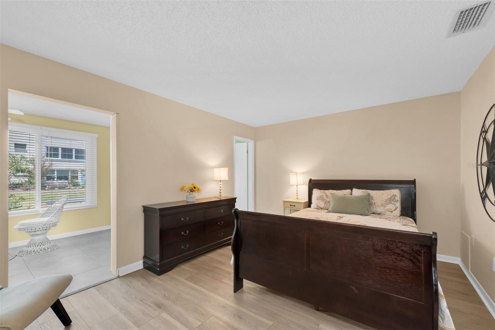 PRIMARY BEDROOM OFF FLORIDA ROOM