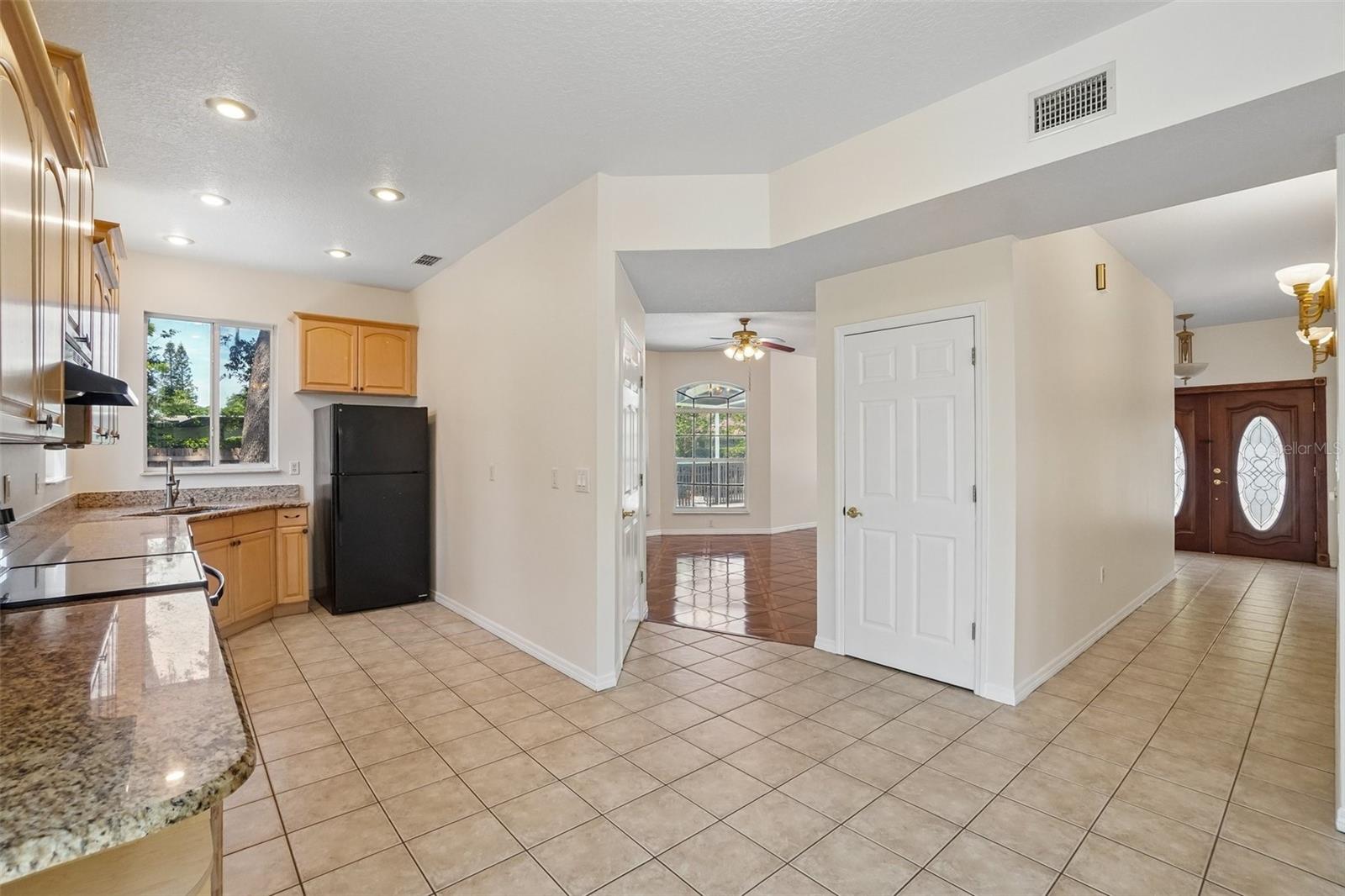 Kitchen, path to Family Room and Hallway to Front Door