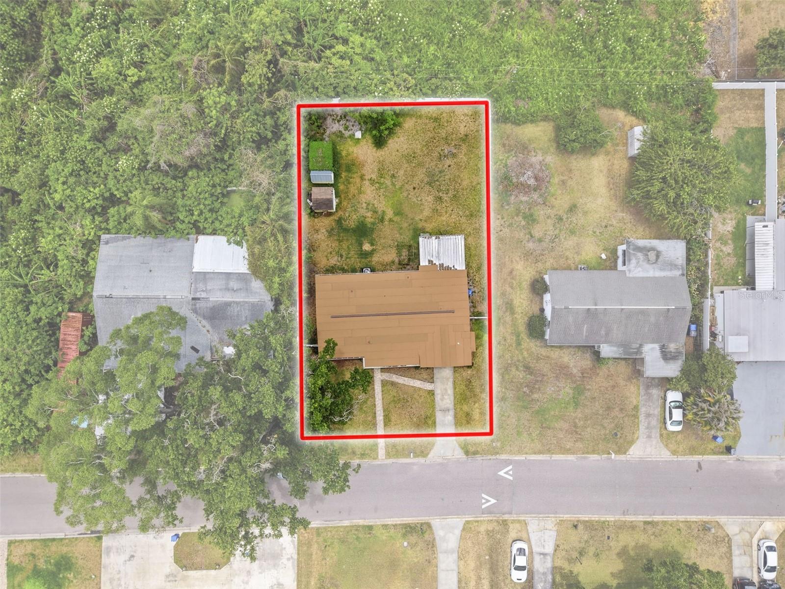 Aerial view of the property that extends 40 ft beyond the backyard fence