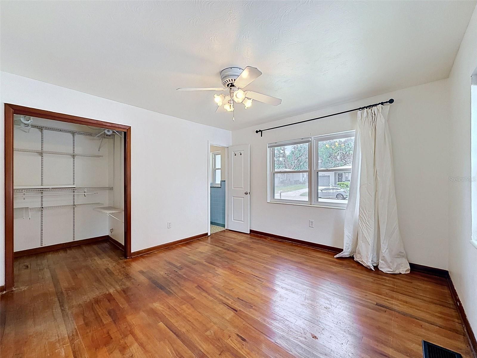 Primary bedroom with walk in closet