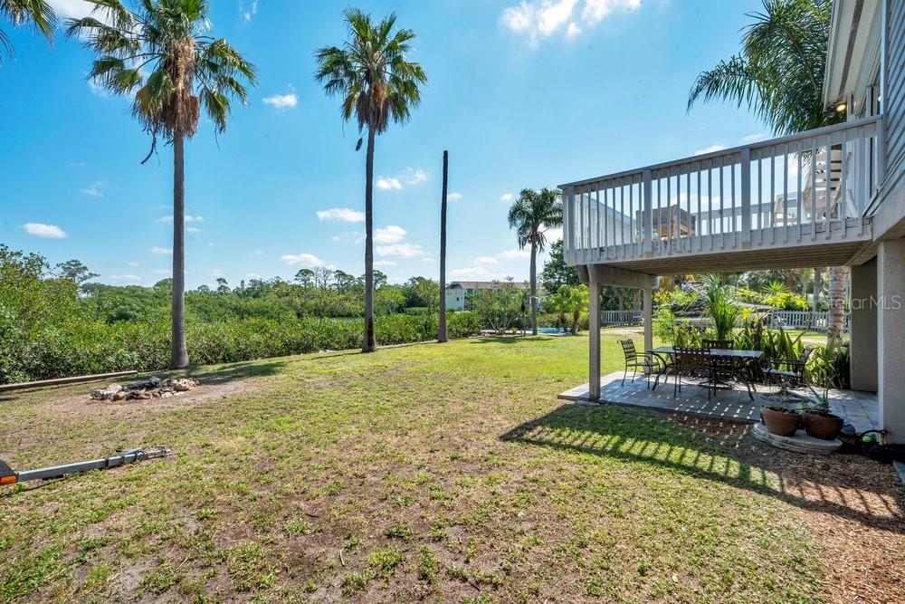 Fire pit and yard to canal to Tampa Bay