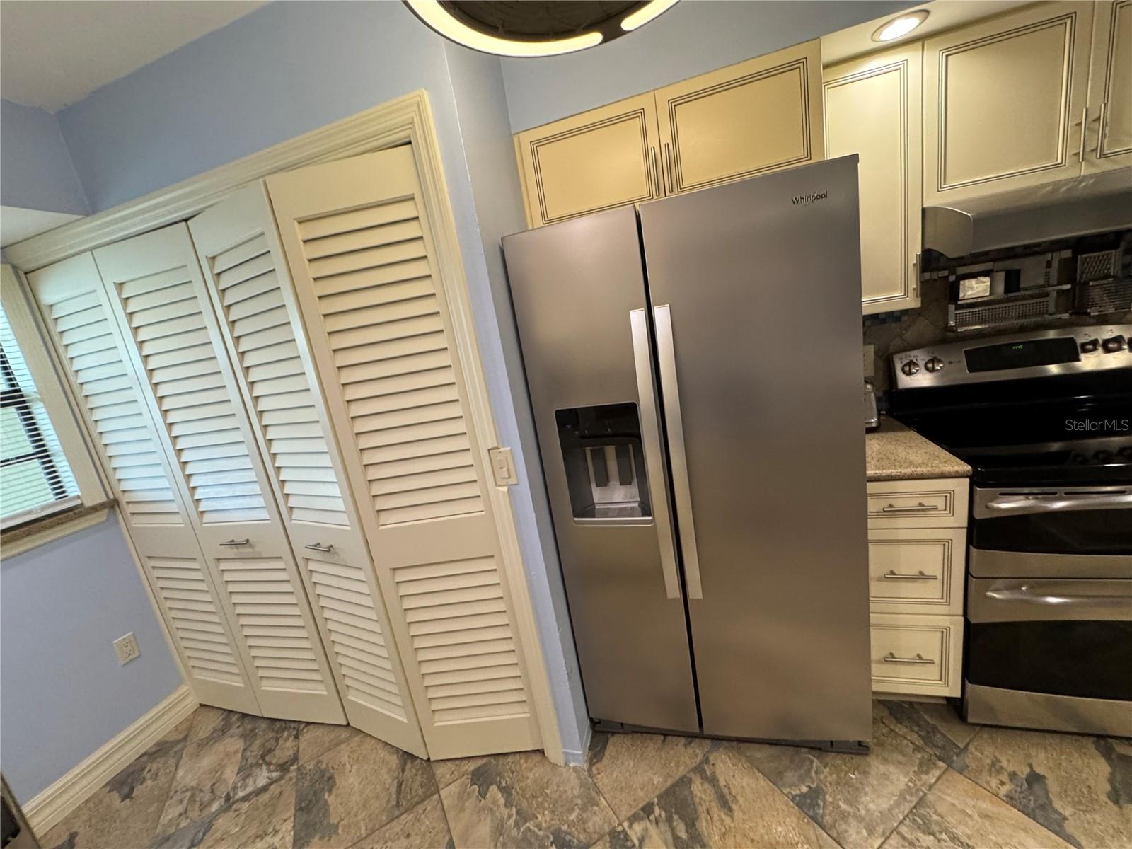 LAUNDRY HIDDEN BEHIND LOUVERED DOORS