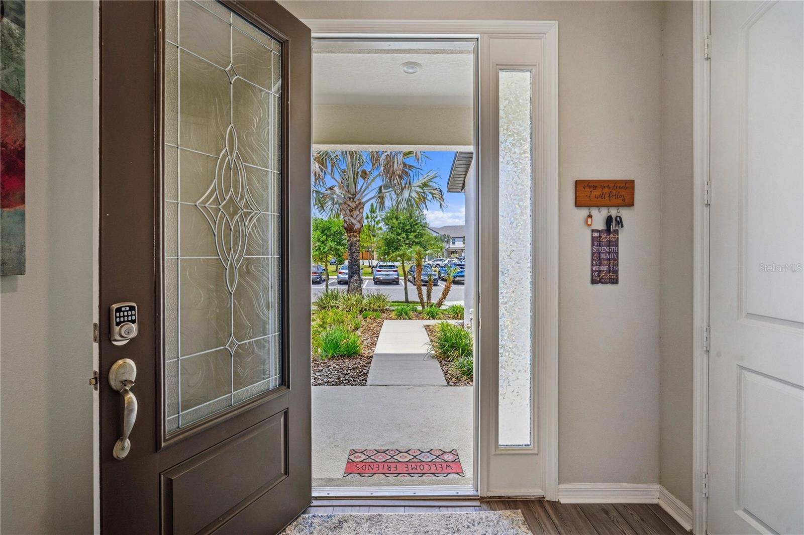 Front door view with tropical palm to welcome you!