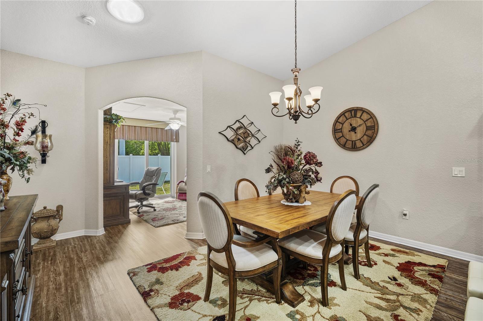 Dining room with archway to den