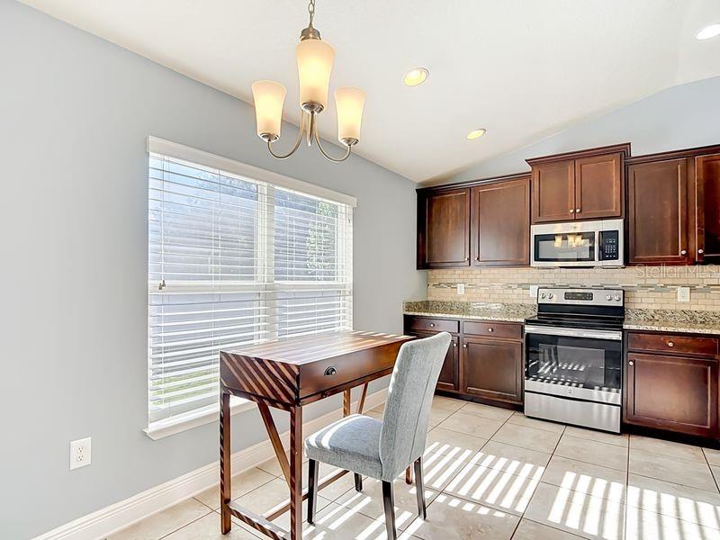 Breakfast nook overlooking kitchen and near pantry