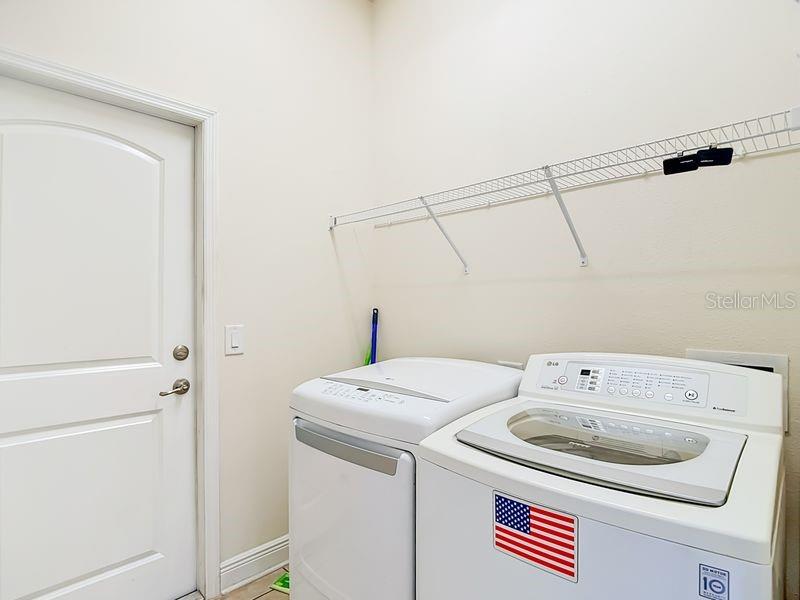 Convenient laundry room located just off kitchen- this space also offers easy access to garage for added functionality