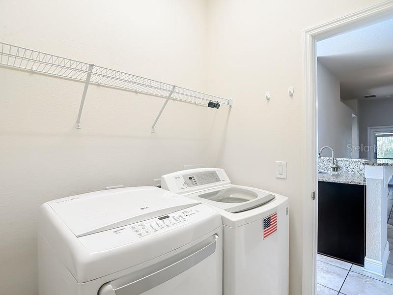 Convenient laundry room located just off kitchen- this space also offers easy access to garage for added functionality