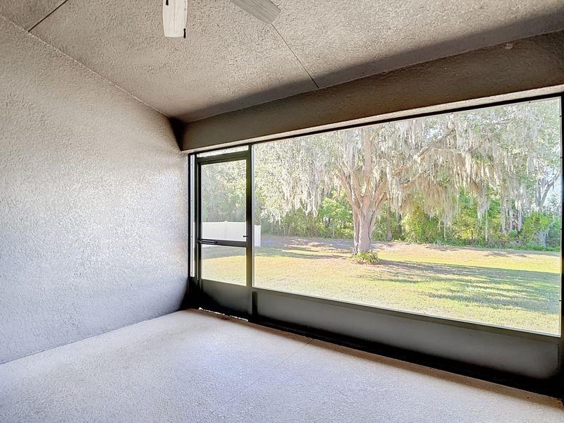 Enjoy tranquil views from the screened in back porch which opens to the spacious backyard. Perfect for relaxing outdoors!!!