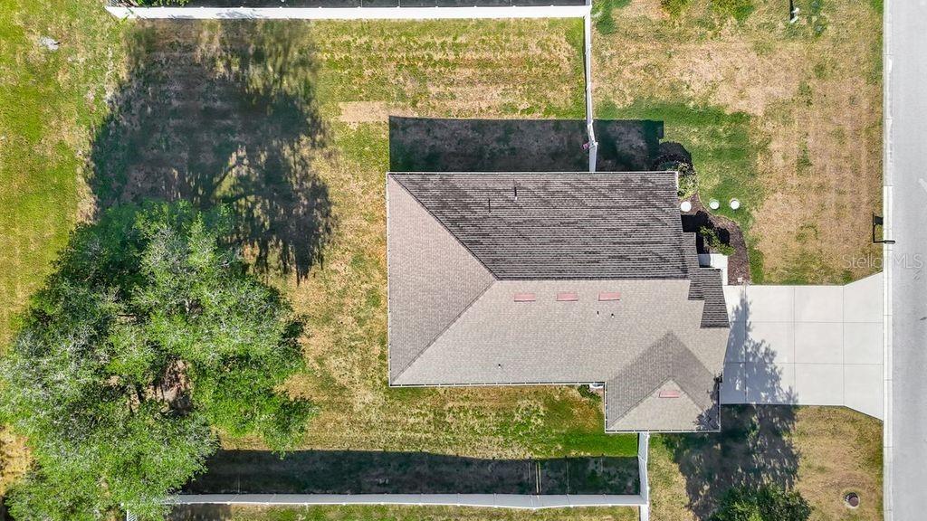 Aerial perspective showcasing the property's expansive nearly half-acre lot