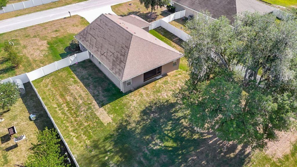Aerial perspective showcasing the property's expansive nearly half-acre lot