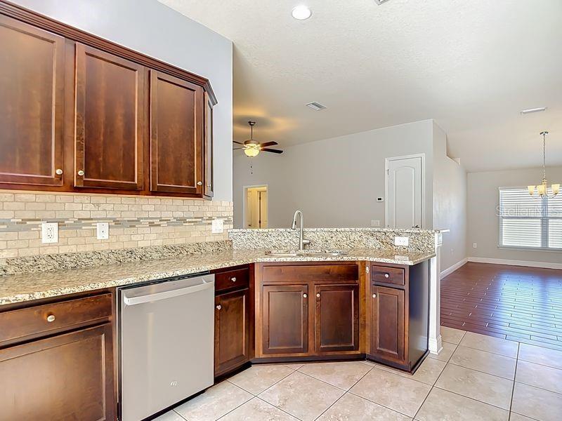 The open design flows seamlessly into the dining and living rooms