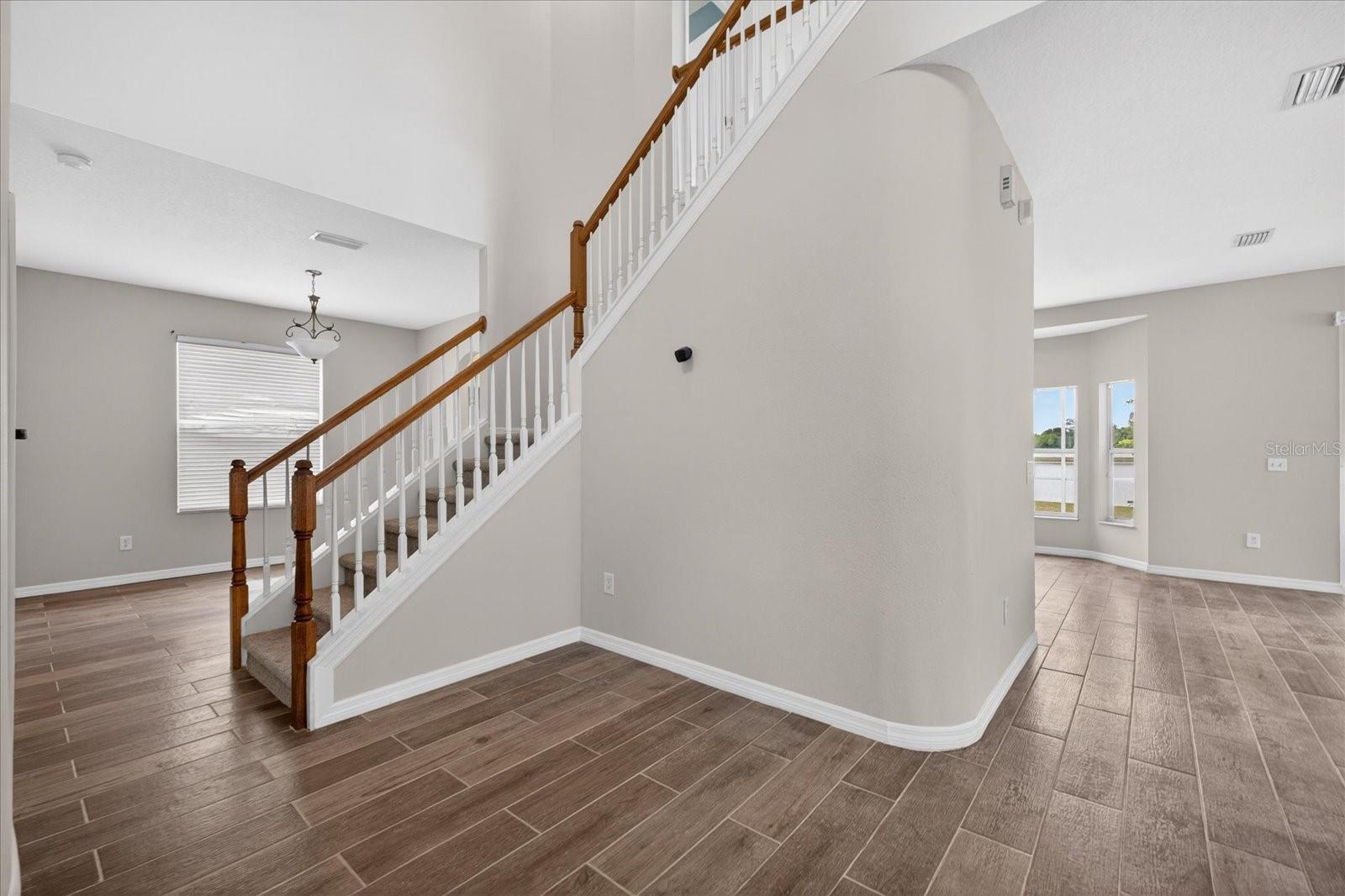 Grand Staircase with Tall Vaulted Cielings
