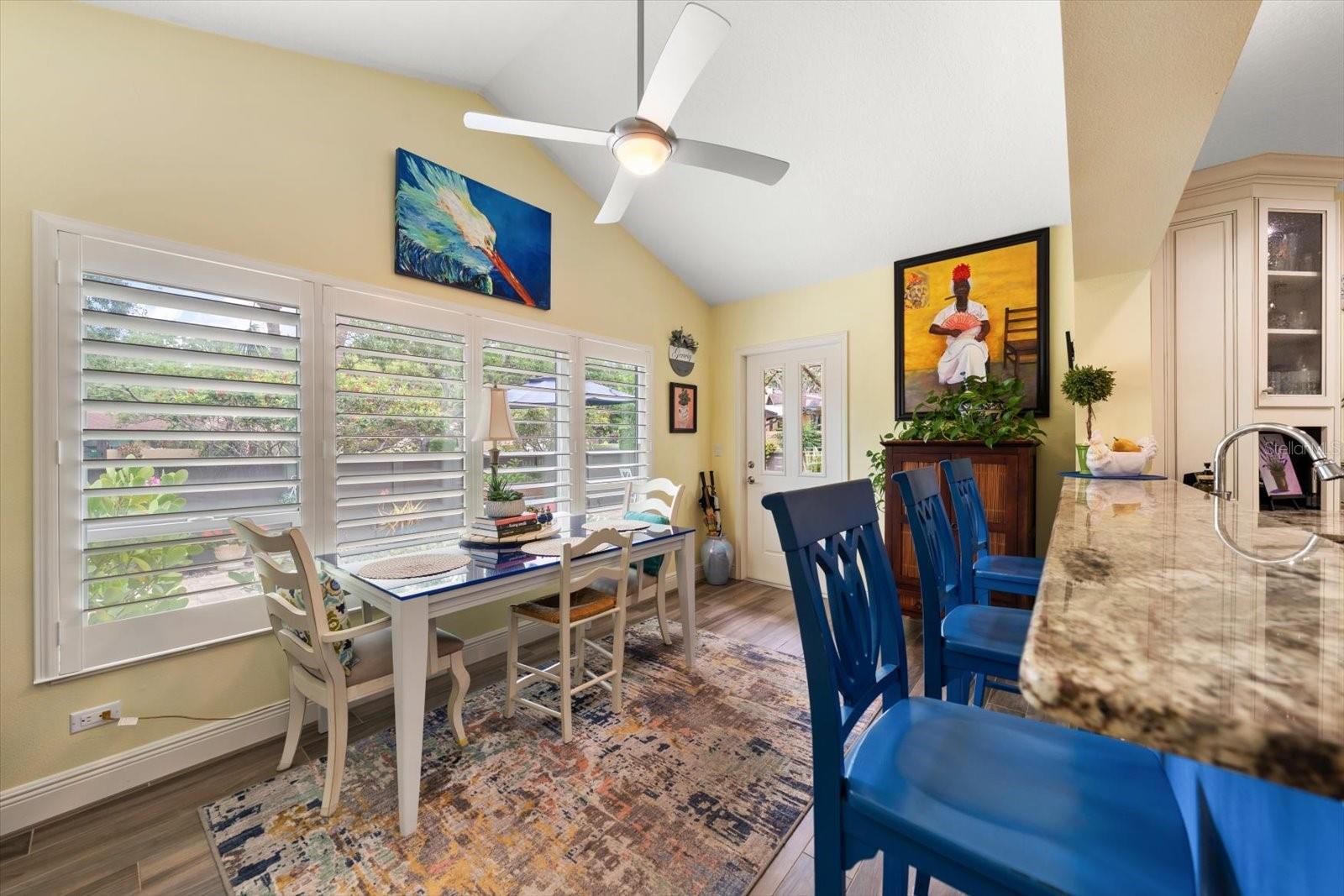 Eat in area off of kitchen is perfectly situated for access to the exterior courtyard of enjoying a bite to eat.