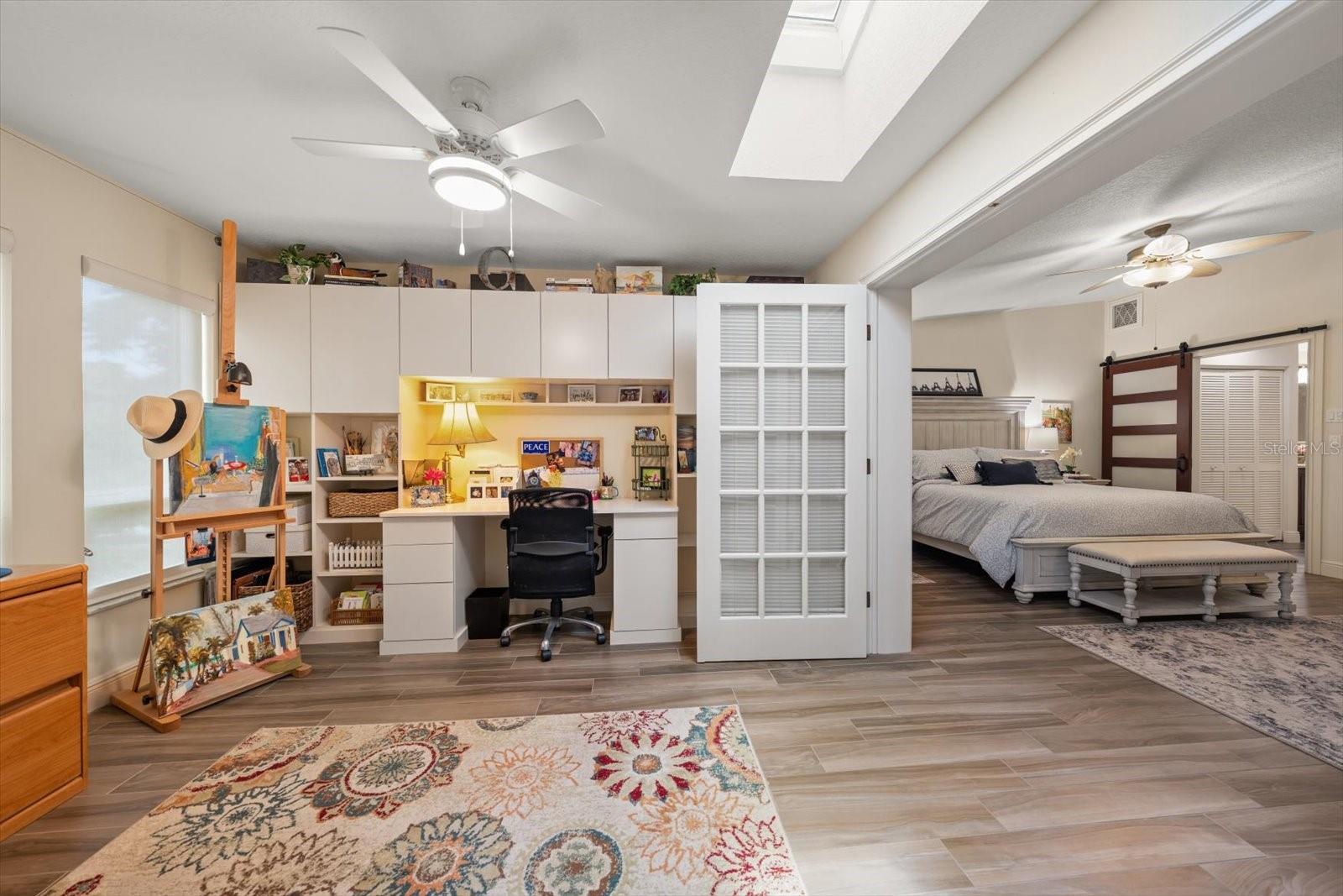 Office with built-ins adjoins the primary suite