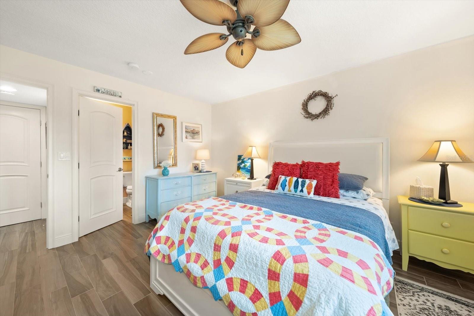 Guest bedroom with ensuite bath and views to grounds and intracoastal.