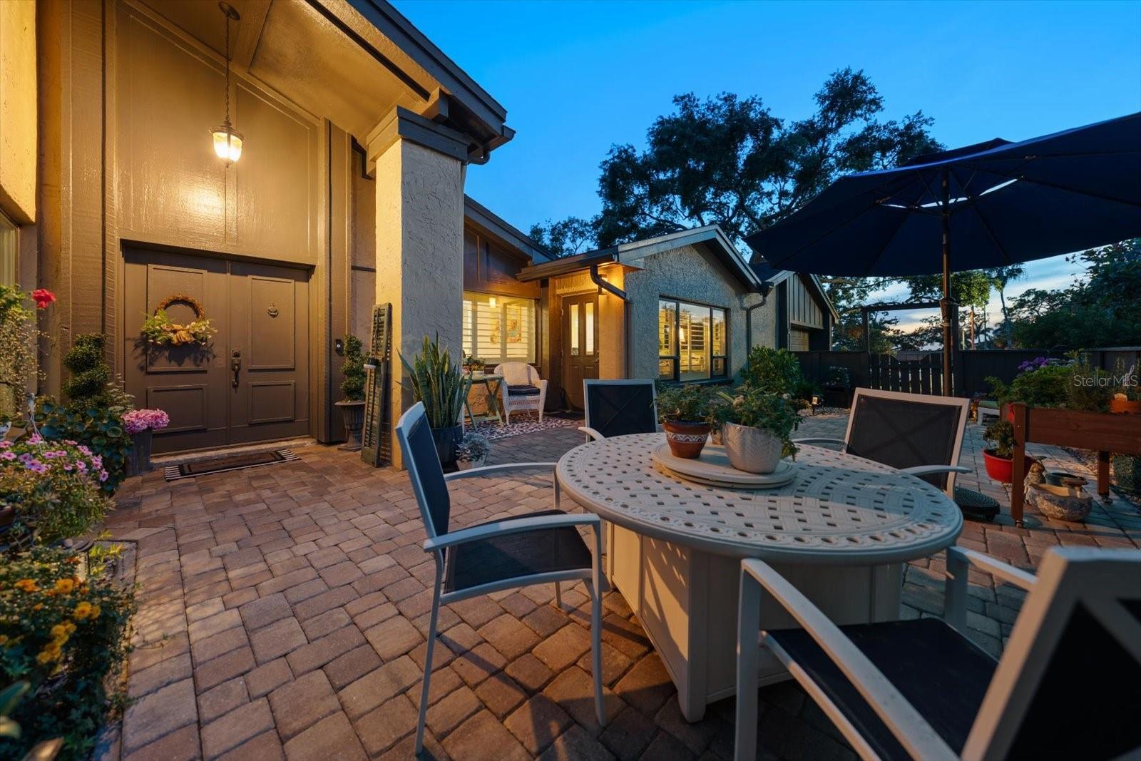 Enhanced by seasonal flowers and seating areas makes this property grcious and appealing.