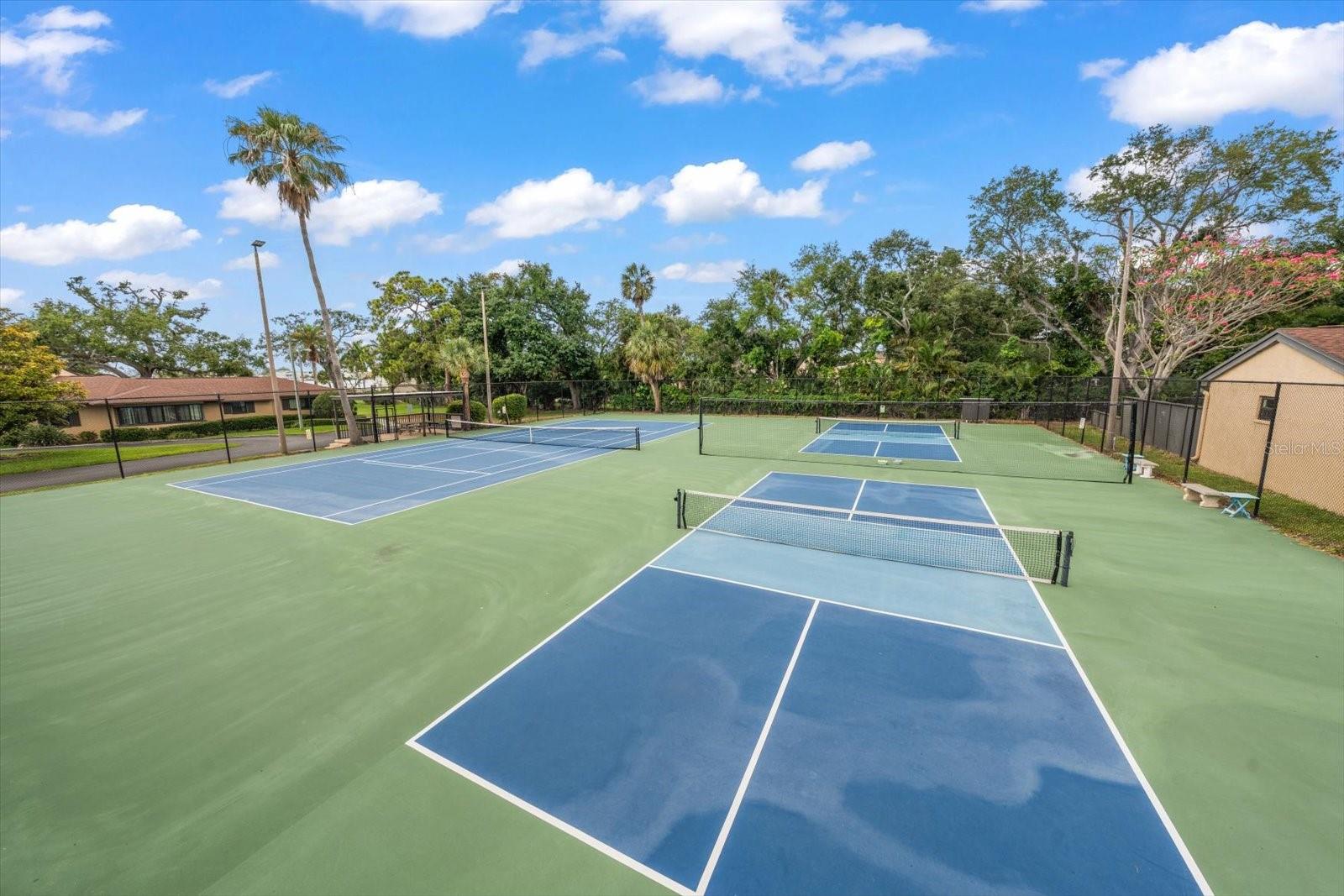 Tennis and pickleball courts adjacent to the clubhouse.