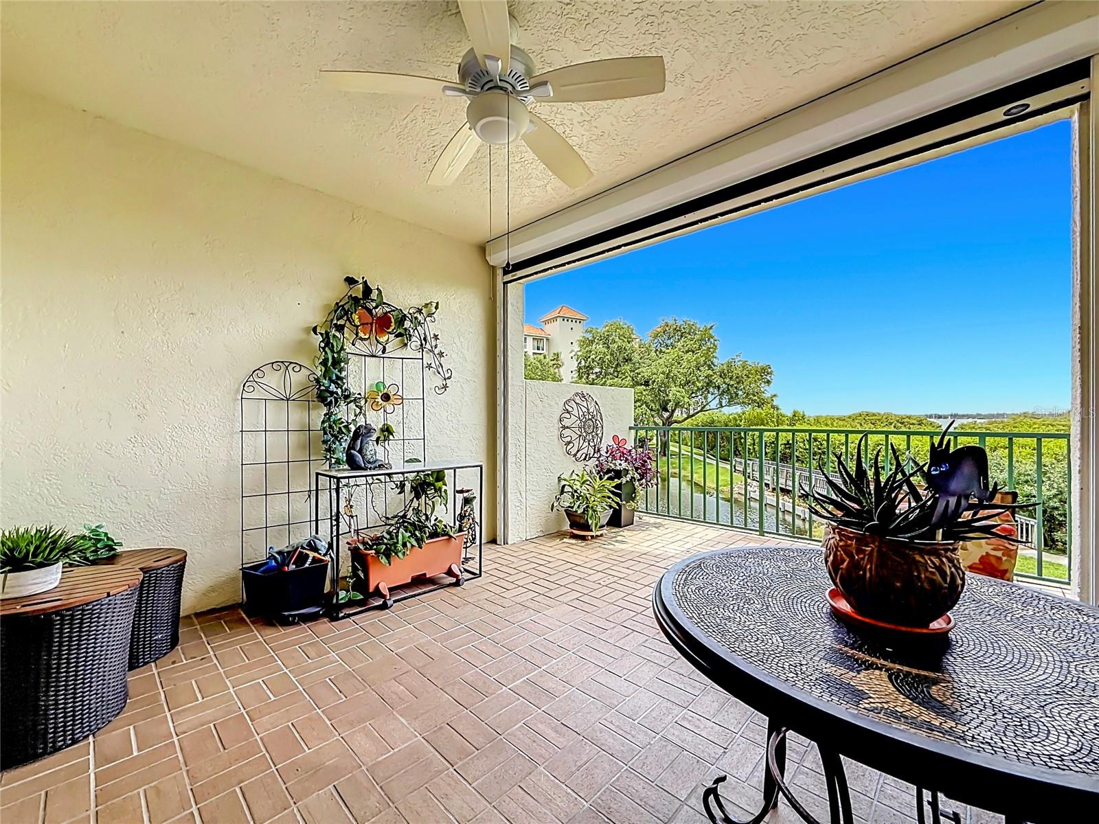 Covered patio with electric hurricane shutter