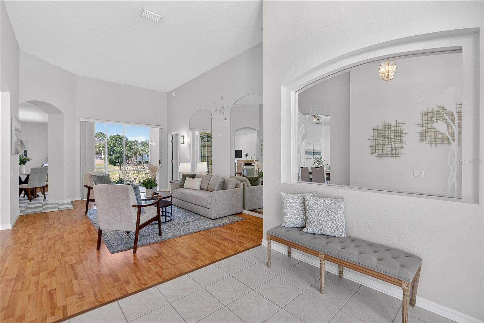 Enter through double glass doors into a formal living room